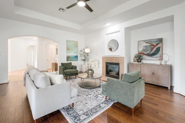 102 Rivulet Ln, Austin, TX 78738 - living area featuring a raised ceiling, arched walkways, hardwood / wood-style floors, and a ceiling fan