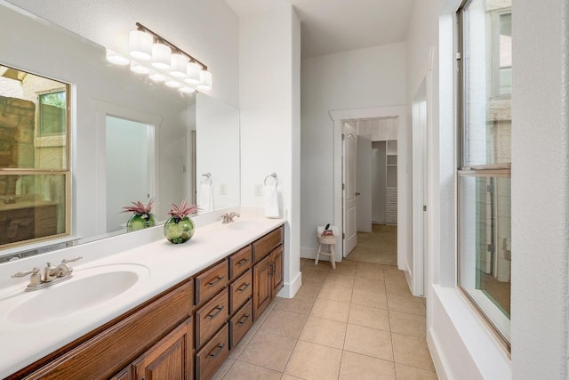 102 Rivulet Ln, Austin, TX 78738 - full bathroom with double vanity, tile patterned floors, and healthy amount of natural light