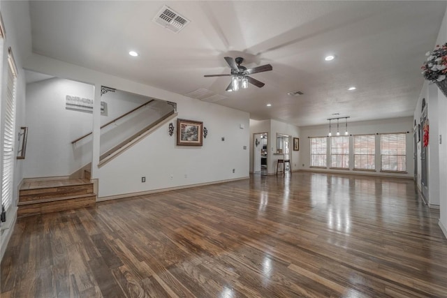 11811 Arabian Trl, Austin, TX 78759 - unfurnished living room featuring ceiling fan, wood finished floors, recessed lighting, and stairs