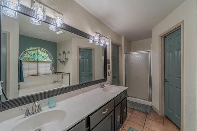 11811 Arabian Trl, Austin, TX 78759 - bathroom with a shower stall, a garden tub, tile patterned flooring, and double vanity