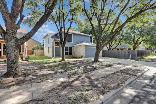 1608 Melibee Trl, Austin, TX 78748 - view of front of property with brick siding, a garage, and concrete driveway