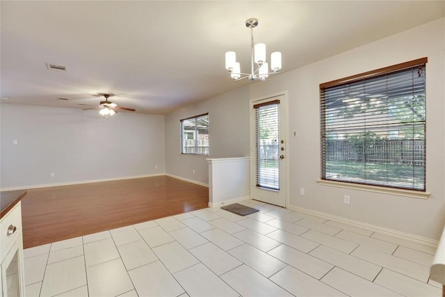 1608 Melibee Trl, Austin, TX 78748 - empty room with a ceiling fan, a chandelier, and light wood-type flooring