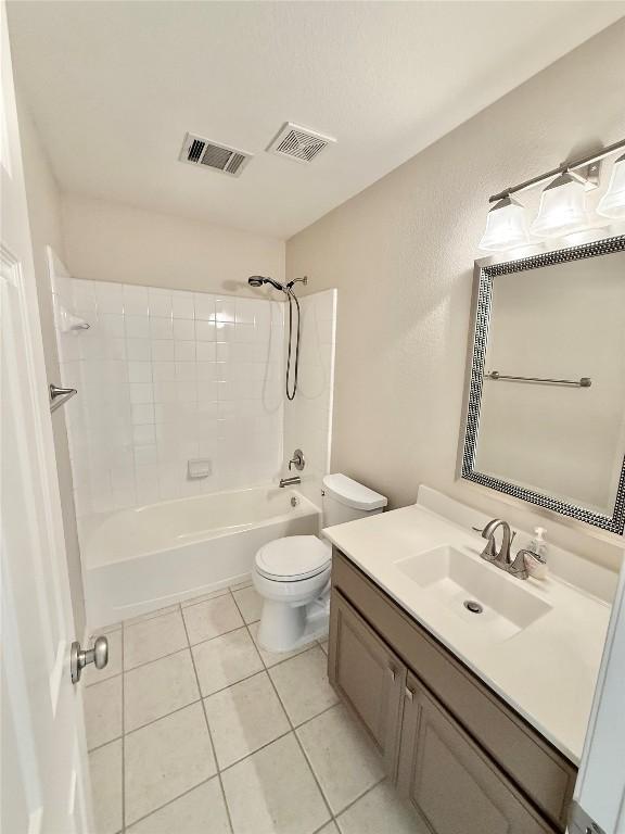 1907 Rutherford Dr, Leander, TX 78641 - full bathroom with vanity, shower / tub combination, and tile patterned floors
