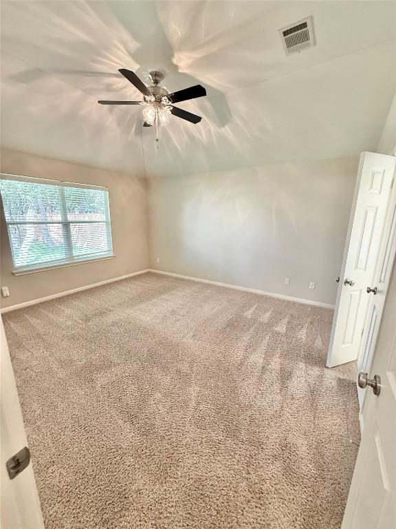 1907 Rutherford Dr, Leander, TX 78641 - spare room featuring carpet floors and a ceiling fan
