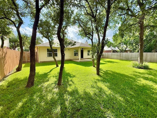 1907 Rutherford Dr, Leander, TX 78641 - fenced backyard with a patio area