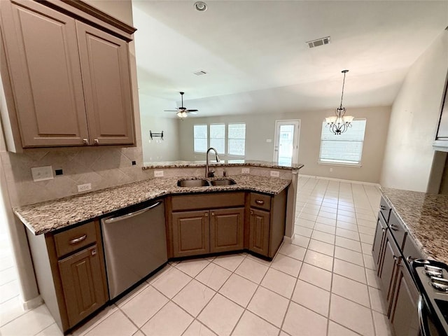 1907 Rutherford Dr, Leander, TX 78641 - kitchen with stainless steel dishwasher, a peninsula, ceiling fan, light tile patterned flooring, and light stone countertops