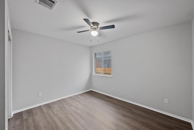 8943 W Hove Loop, Austin, TX 78749 - empty room with wood finished floors and ceiling fan