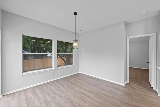 8943 W Hove Loop, Austin, TX 78749 - unfurnished dining area with wood finished floors and baseboards