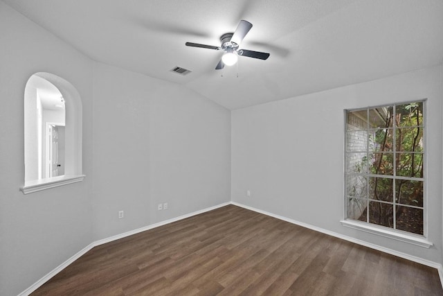 8943 W Hove Loop, Austin, TX 78749 - unfurnished room featuring wood finished floors, ceiling fan, vaulted ceiling, and arched walkways