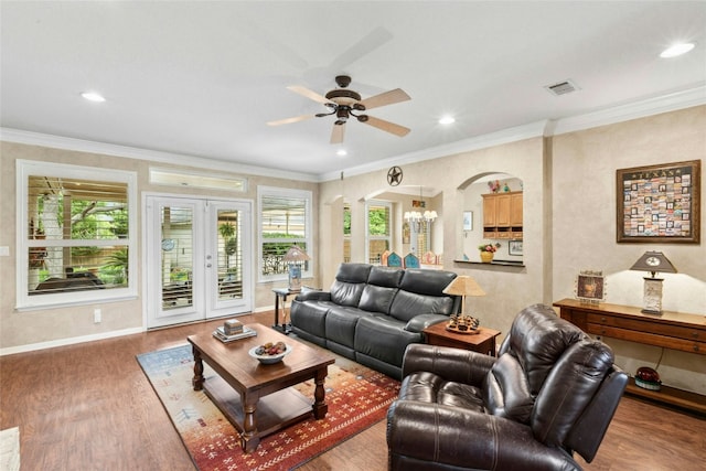 5100 Hadle Cv, Austin, TX 78730 - living room with arched walkways, a ceiling fan, wood finished floors, ornamental molding, and recessed lighting
