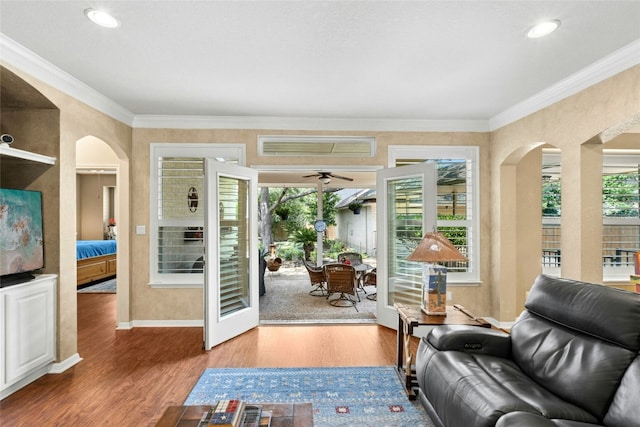 5100 Hadle Cv, Austin, TX 78730 - sitting room with arched walkways, wood finished floors, a ceiling fan, ornamental molding, and recessed lighting