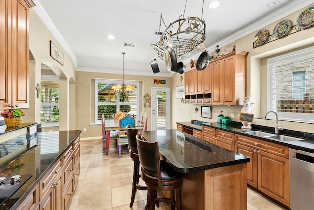 5100 Hadle Cv, Austin, TX 78730 - kitchen featuring dishwasher, crown molding, a chandelier, dark stone counters, and arched walkways