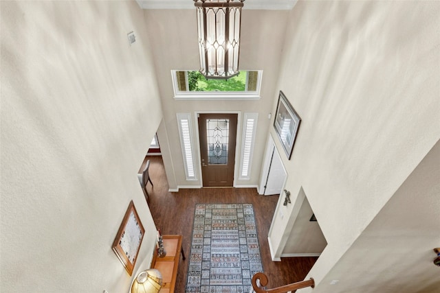 5100 Hadle Cv, Austin, TX 78730 - entrance foyer featuring a chandelier, wood finished floors, and a towering ceiling