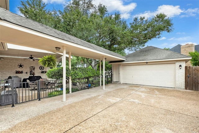 5100 Hadle Cv, Austin, TX 78730 - garage featuring ceiling fan and driveway