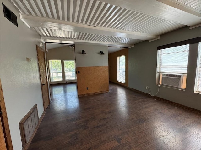 572 Eastern Ave, Bertram, TX 78605 - spare room featuring beamed ceiling, dark wood-style floors, and cooling unit