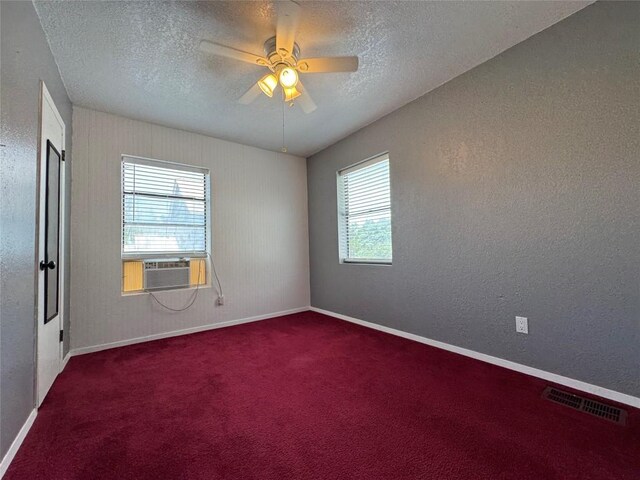 572 Eastern Ave, Bertram, TX 78605 - spare room featuring a ceiling fan, a textured ceiling, carpet flooring, and cooling unit