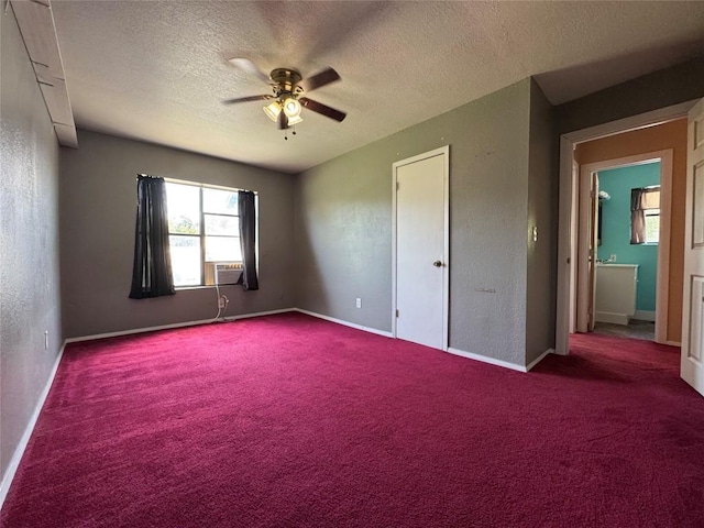 572 Eastern Ave, Bertram, TX 78605 - unfurnished bedroom with carpet flooring, a textured ceiling, a ceiling fan, and cooling unit