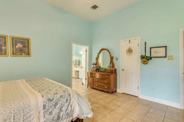 307 N Rainbow Bridge Dr, Cedar Park, TX 78613 - bedroom with light tile patterned flooring, a high ceiling, and ensuite bathroom