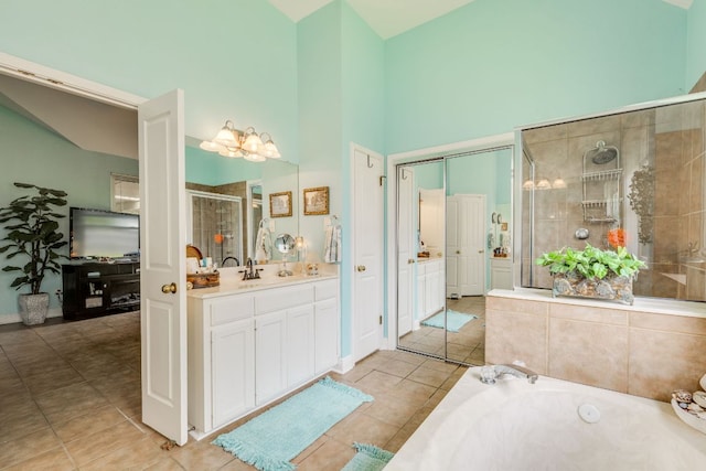 307 N Rainbow Bridge Dr, Cedar Park, TX 78613 - full bathroom featuring vanity, a stall shower, a bath, tile patterned flooring, and a high ceiling