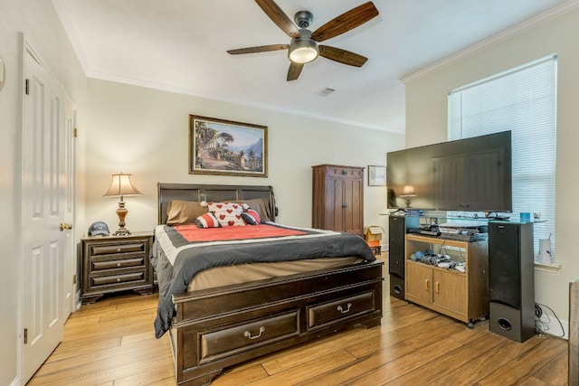 307 N Rainbow Bridge Dr, Cedar Park, TX 78613 - bedroom with ornamental molding, light wood-type flooring, and a ceiling fan