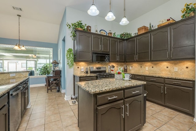 307 N Rainbow Bridge Dr, Cedar Park, TX 78613 - kitchen with appliances with stainless steel finishes, light tile patterned flooring, decorative backsplash, pendant lighting, and light stone counters