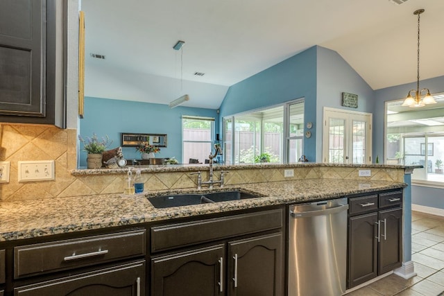 307 N Rainbow Bridge Dr, Cedar Park, TX 78613 - kitchen with stainless steel dishwasher, lofted ceiling, light tile patterned flooring, backsplash, and dark brown cabinetry