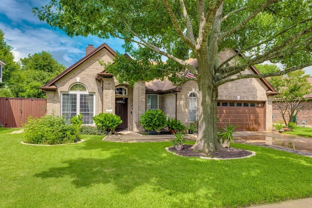 307 N Rainbow Bridge Dr, Cedar Park, TX 78613 - view of front of home with brick siding, a chimney, driveway, and a garage