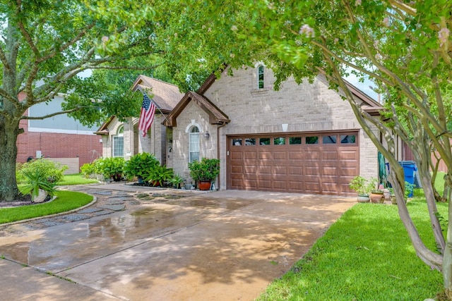307 N Rainbow Bridge Dr, Cedar Park, TX 78613 - view of front of house with driveway, a garage, brick siding, and a front lawn