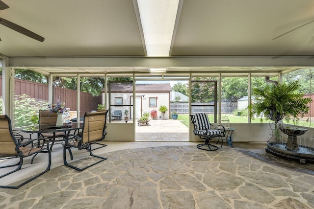 307 N Rainbow Bridge Dr, Cedar Park, TX 78613 - sunroom featuring stone flooring, ceiling fan, outdoor dining space, and plenty of natural light