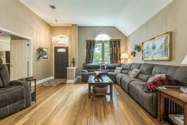 307 N Rainbow Bridge Dr, Cedar Park, TX 78613 - living area featuring light wood finished floors, a chandelier, and lofted ceiling