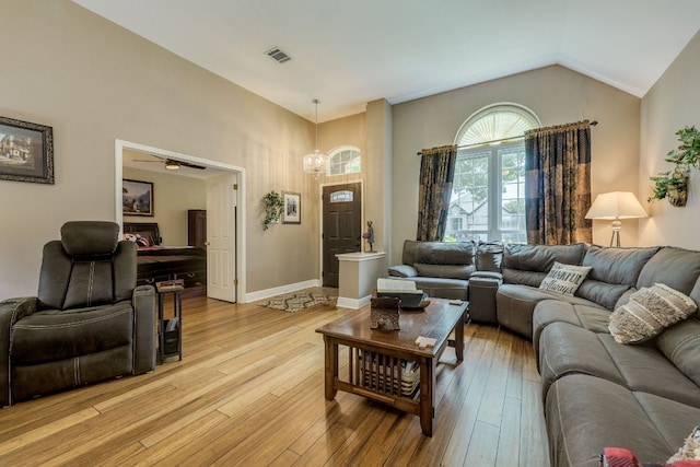 307 N Rainbow Bridge Dr, Cedar Park, TX 78613 - living area with a chandelier, light wood-style floors, and vaulted ceiling