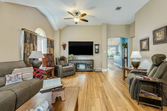 307 N Rainbow Bridge Dr, Cedar Park, TX 78613 - living room featuring ceiling fan, arched walkways, light wood-style floors, and lofted ceiling