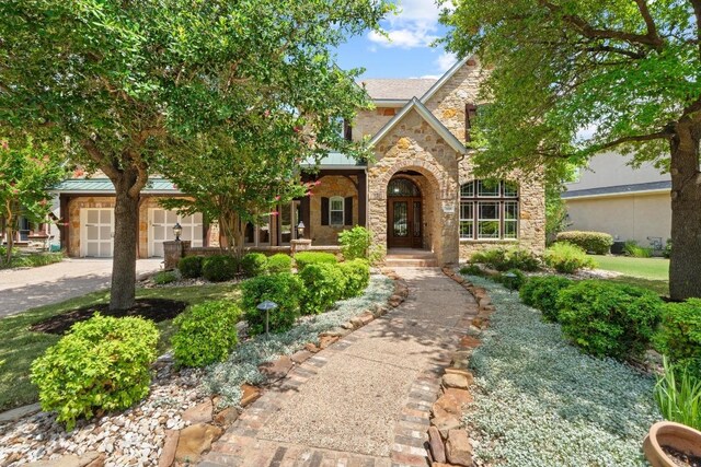 908 Lakewood Hills Ter, Austin, TX 78732 - view of front of property with stone siding and driveway