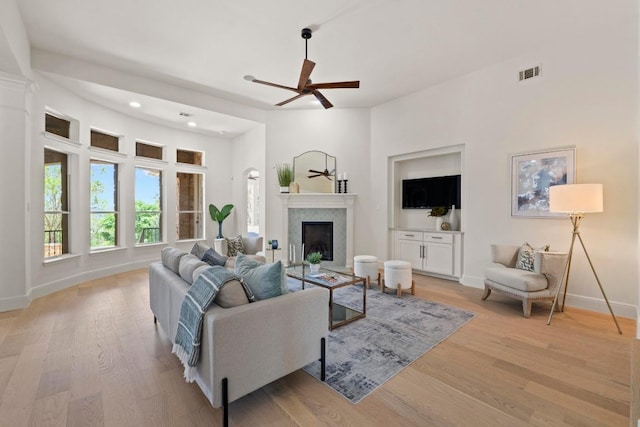 908 Lakewood Hills Ter, Austin, TX 78732 - living area with a ceiling fan, light wood finished floors, a fireplace, and recessed lighting