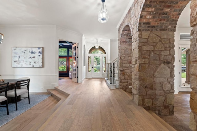 908 Lakewood Hills Ter, Austin, TX 78732 - entryway featuring wood finished floors, ornamental molding, and stairs