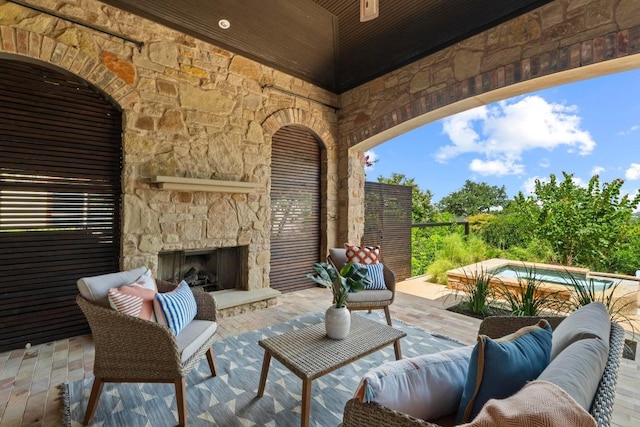 908 Lakewood Hills Ter, Austin, TX 78732 - view of patio / terrace with an outdoor living space with a fireplace and an outdoor pool