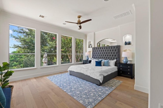 908 Lakewood Hills Ter, Austin, TX 78732 - bedroom with ornamental molding, wood finished floors, and ceiling fan