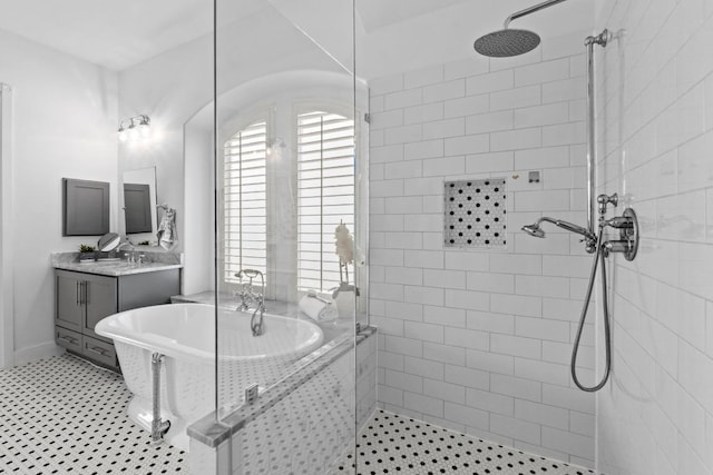 908 Lakewood Hills Ter, Austin, TX 78732 - full bath featuring a soaking tub, a stall shower, and vanity