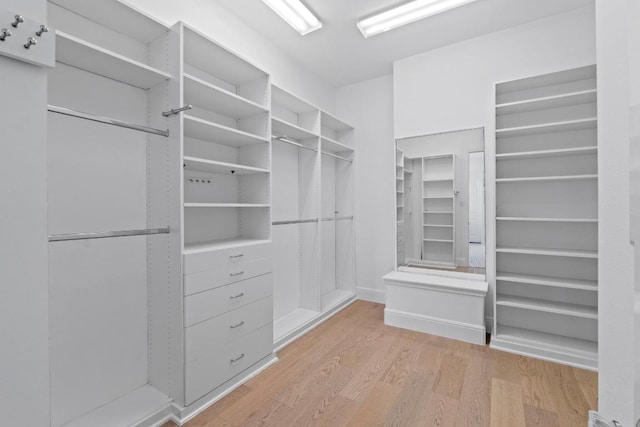 908 Lakewood Hills Ter, Austin, TX 78732 - spacious closet featuring wood finished floors