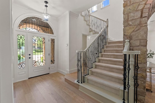 908 Lakewood Hills Ter, Austin, TX 78732 - entryway featuring a towering ceiling, stairway, and wood finished floors
