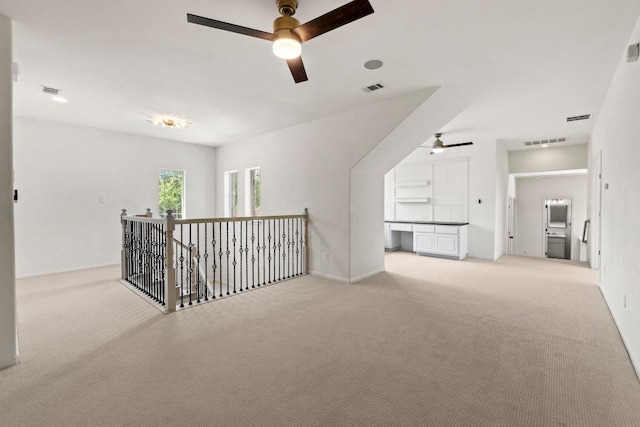908 Lakewood Hills Ter, Austin, TX 78732 - spare room featuring a ceiling fan, light colored carpet, and an office area