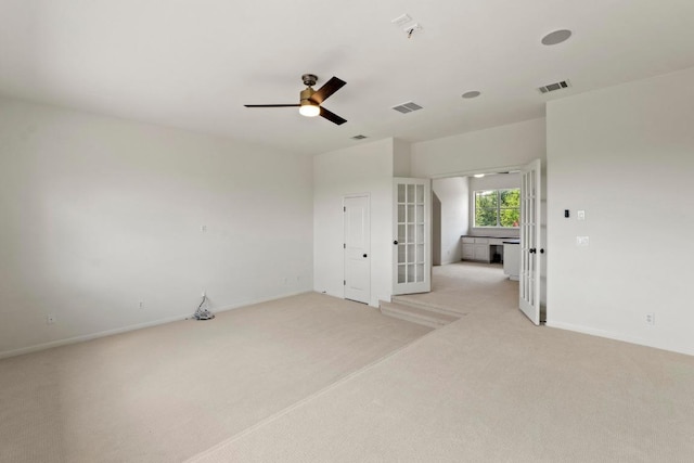 908 Lakewood Hills Ter, Austin, TX 78732 - spare room featuring french doors, light colored carpet, and a ceiling fan