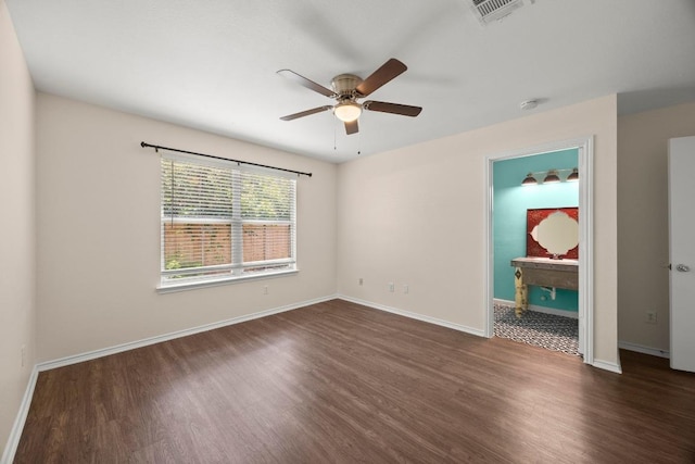 13620 Merseyside Dr, Pflugerville, TX 78660 - empty room with dark wood finished floors, a ceiling fan, and a smoke detector