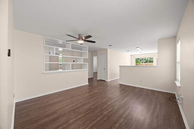 13620 Merseyside Dr, Pflugerville, TX 78660 - unfurnished living room featuring dark wood-style floors and a ceiling fan