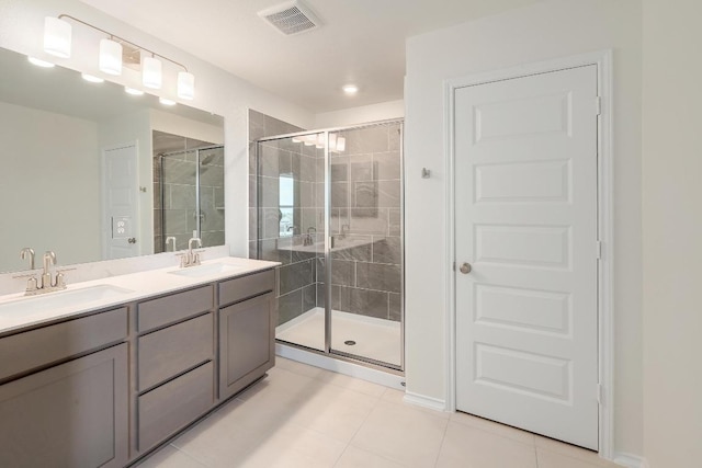 4852 Mozzafiato Ln, Round Rock, TX 78665 - full bath featuring a shower stall, tile patterned floors, and double vanity