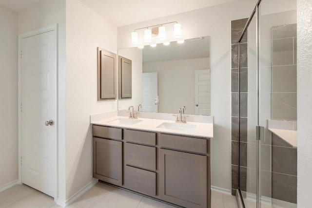 4852 Mozzafiato Ln, Round Rock, TX 78665 - full bathroom with double vanity, a shower stall, and tile patterned flooring