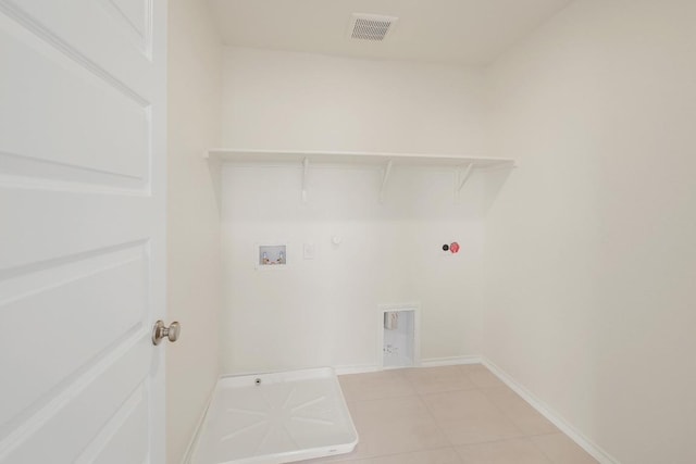 4852 Mozzafiato Ln, Round Rock, TX 78665 - washroom featuring gas dryer hookup, light tile patterned flooring, washer hookup, and electric dryer hookup