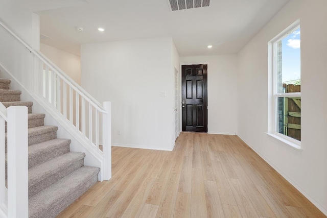 4852 Mozzafiato Ln, Round Rock, TX 78665 - entryway featuring light wood-style flooring, stairs, and recessed lighting