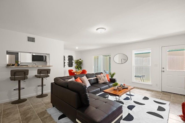 6718 Silvermine Dr Unit 802, Austin, TX 78736 - living room featuring tile patterned floors and baseboards