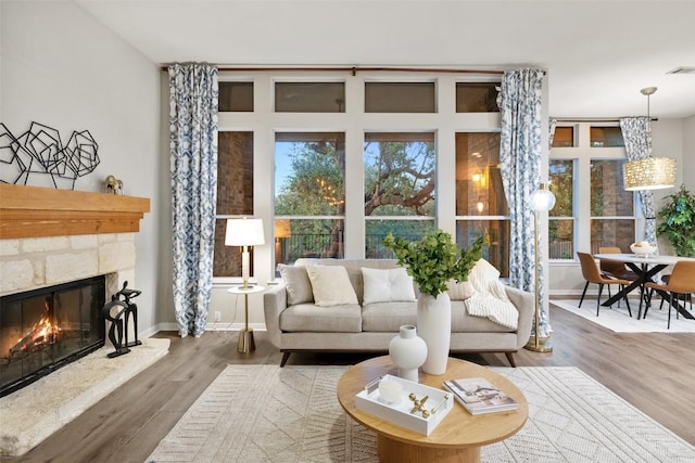 128 Big Sky Cv, Austin, TX 78737 - living room with a fireplace and wood finished floors